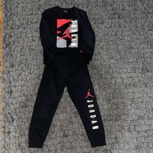 Jordan 2 piece black sweat suit.